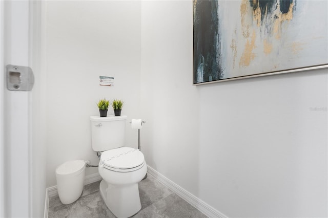 bathroom featuring tile patterned floors and toilet