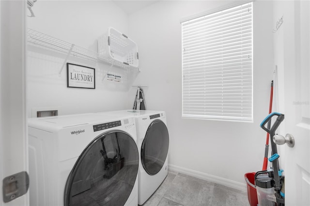 washroom featuring washer and dryer and light tile patterned floors