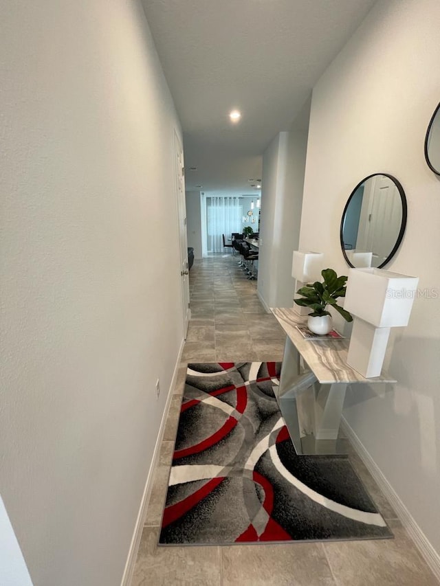 hallway with light tile patterned floors