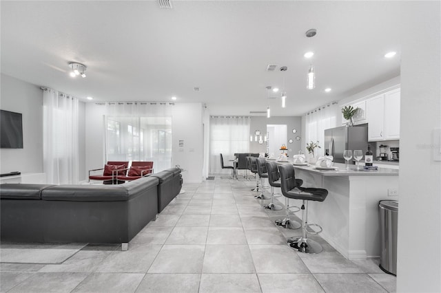 living room with light tile patterned floors