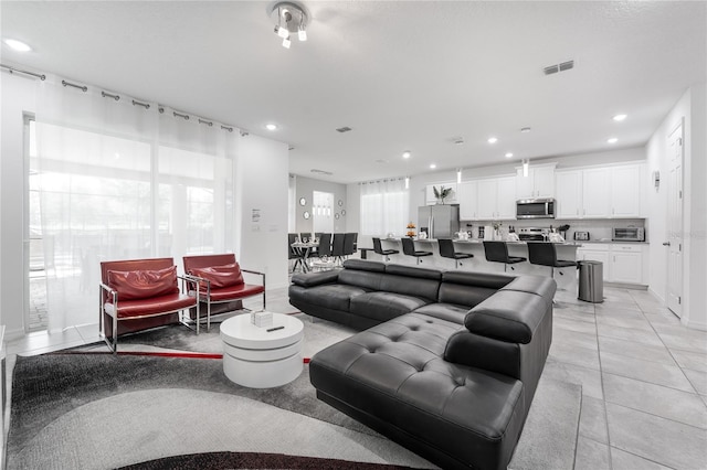 living room with light tile patterned floors