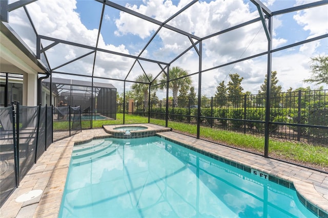 view of pool with an in ground hot tub and a lanai