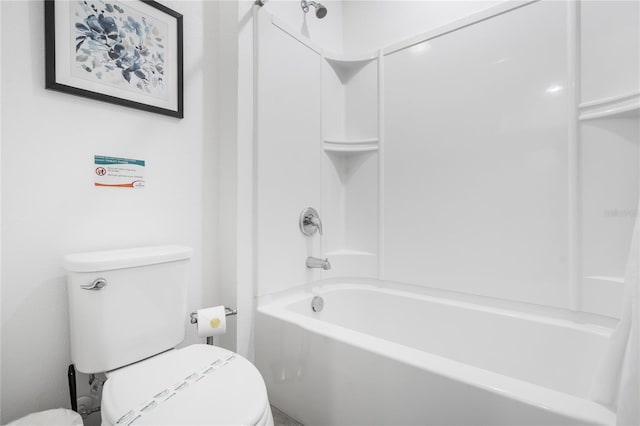 bathroom featuring bathtub / shower combination and toilet