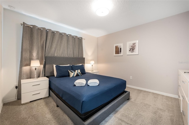 bedroom featuring light colored carpet