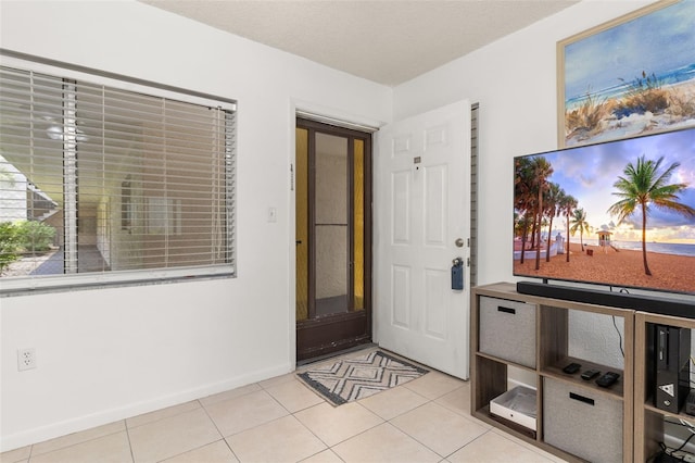 foyer with light tile patterned floors