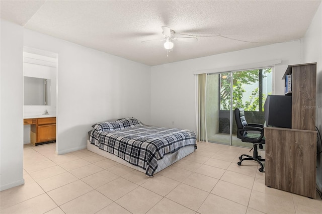 bedroom featuring ensuite bathroom, a textured ceiling, ceiling fan, and light tile patterned floors