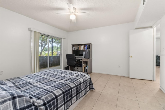 bedroom with baseboards, a textured ceiling, light tile patterned flooring, access to exterior, and a ceiling fan