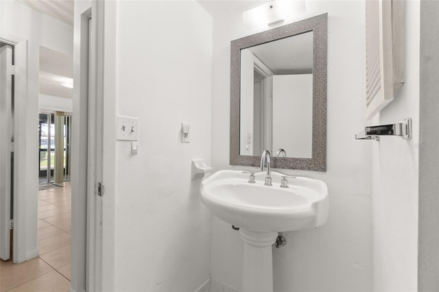 bathroom with tile patterned floors