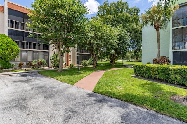 surrounding community featuring a yard