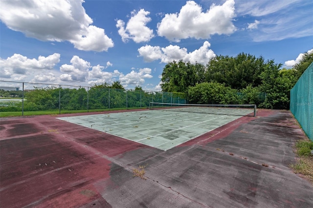 view of sport court with fence