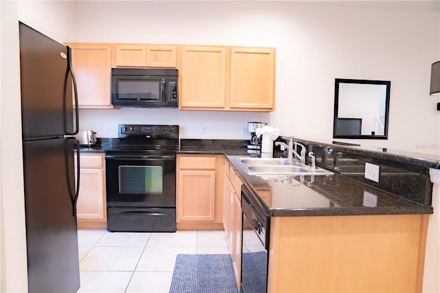 kitchen featuring light brown cabinets, kitchen peninsula, black appliances, and light tile patterned floors