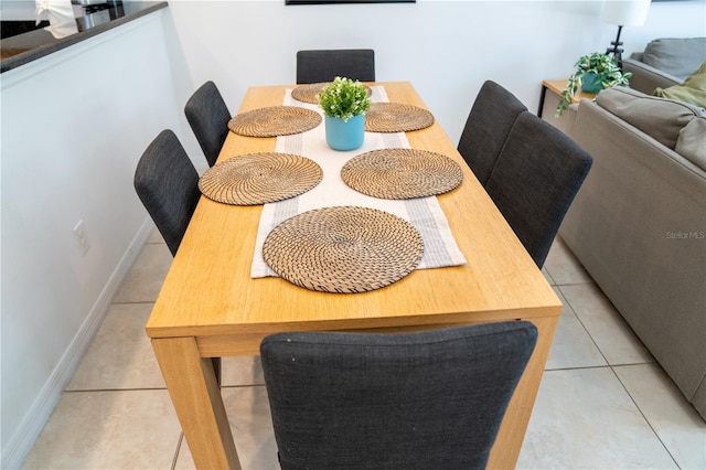 dining area featuring light tile patterned floors