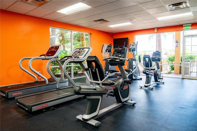 gym featuring a paneled ceiling