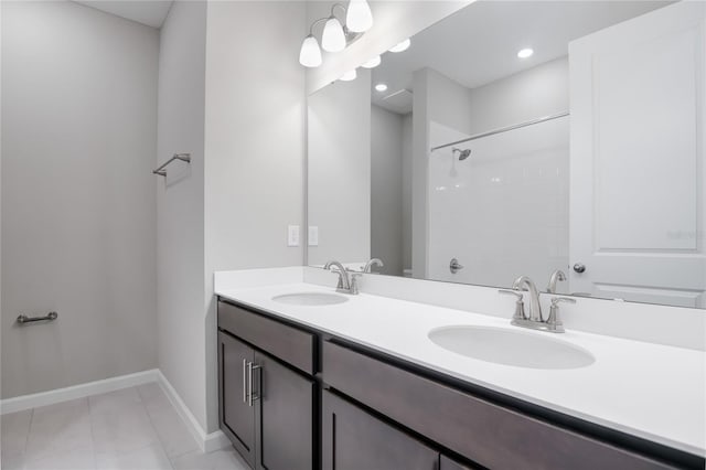 bathroom with tile patterned flooring and vanity