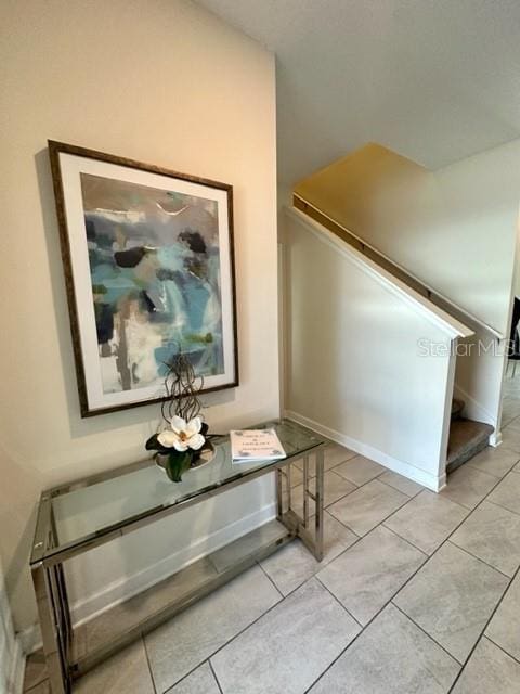 hallway featuring light tile patterned floors