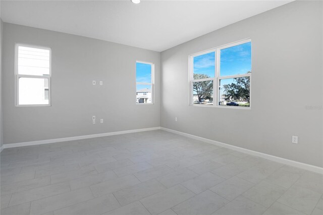 unfurnished room featuring a healthy amount of sunlight