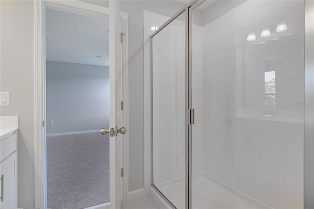 bathroom with an enclosed shower and vanity