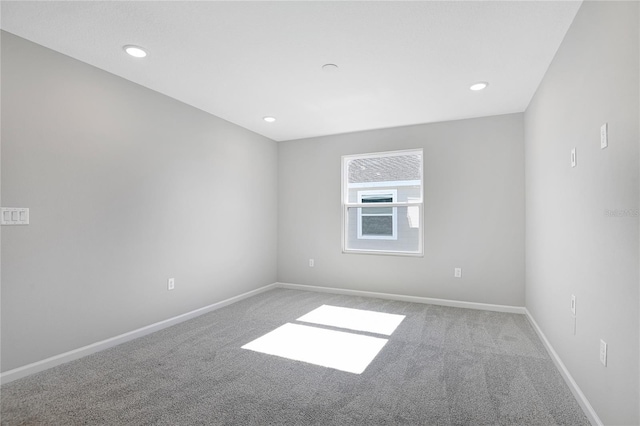 unfurnished room featuring carpet