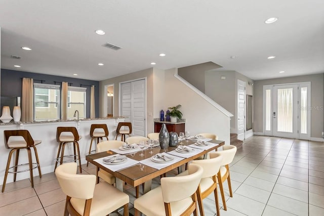 dining area with light tile patterned floors