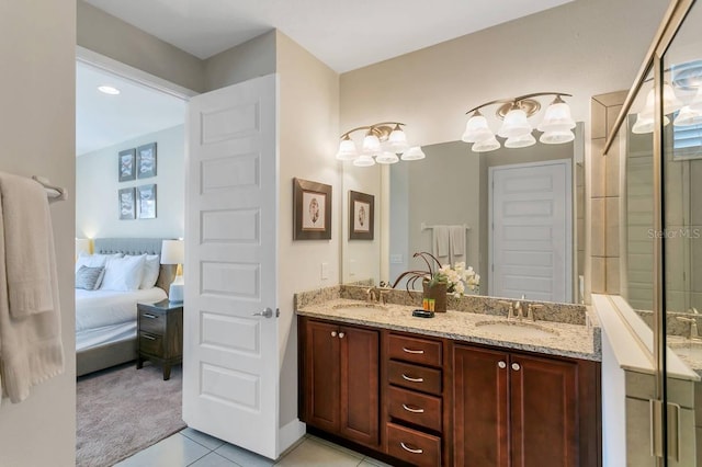 bathroom with double sink vanity and tile patterned flooring