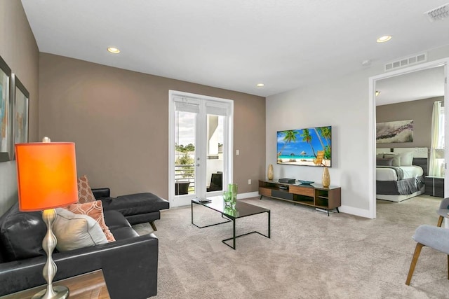 carpeted living room featuring french doors