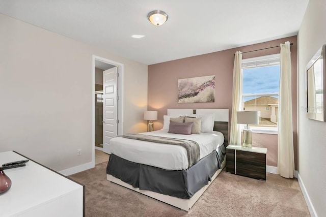 bedroom featuring light colored carpet