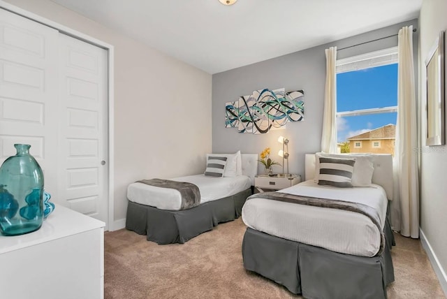 carpeted bedroom featuring a closet