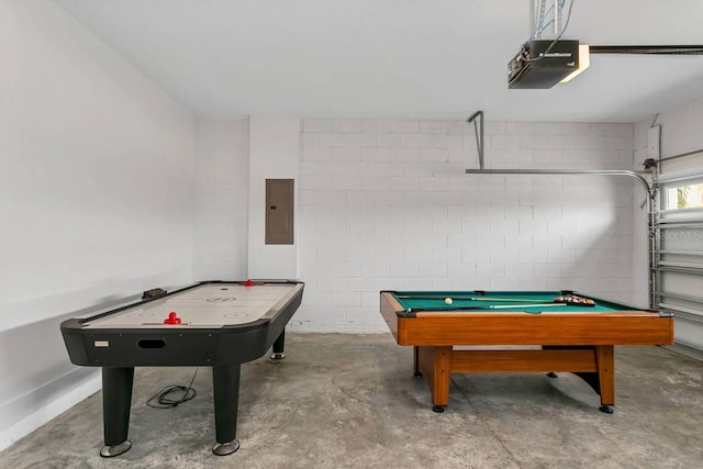 recreation room with billiards, concrete floors, and electric panel