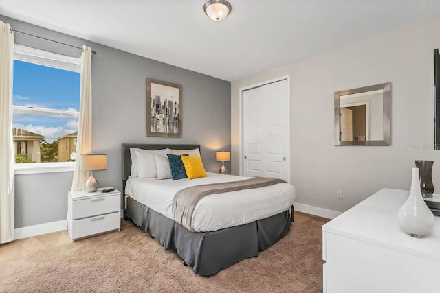 carpeted bedroom featuring a closet