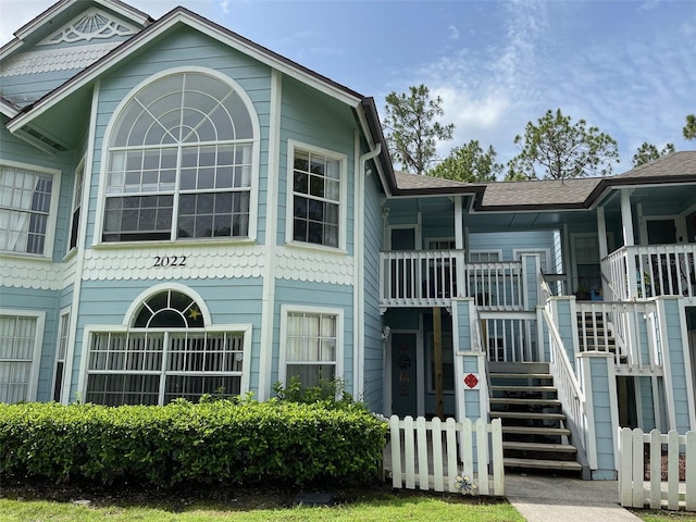 2022 Royal Bay Blvd Unit 93, Kissimmee, FL 34746 - view of property featuring stairs and fence