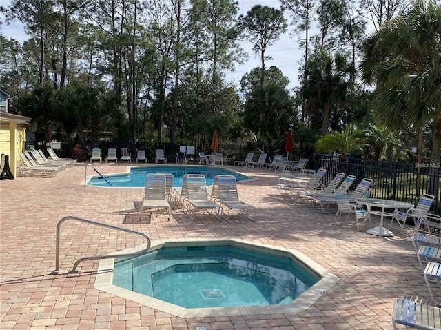 view of pool featuring a community hot tub