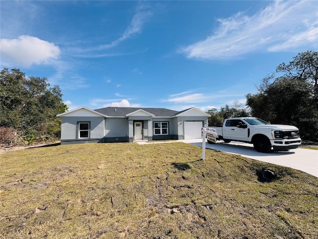 single story home featuring a garage and a front yard