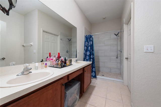 bathroom with curtained shower, double sink vanity, and tile patterned flooring