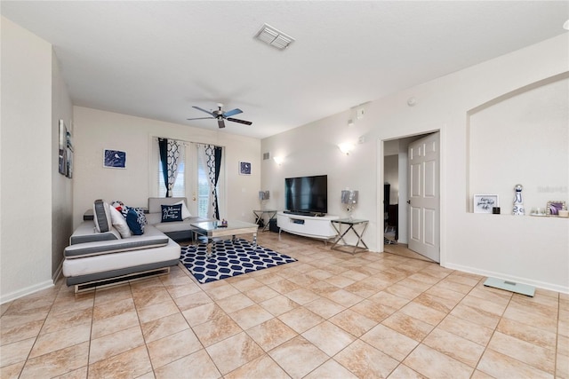 tiled living room featuring ceiling fan