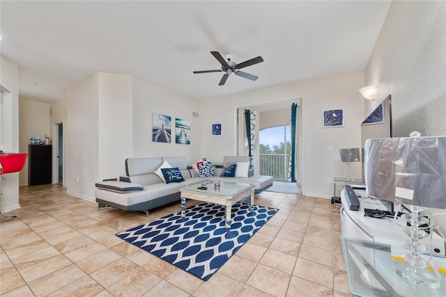 tiled living room featuring ceiling fan