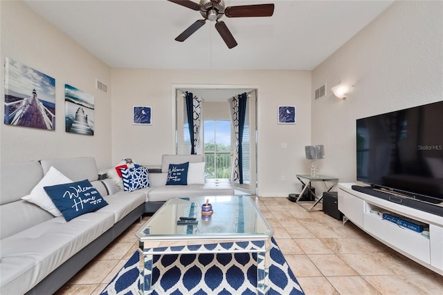 tiled living room featuring ceiling fan