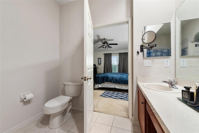 bathroom featuring tile patterned floors, toilet, vanity, and ceiling fan