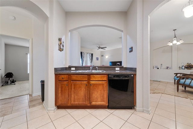 kitchen with sink, dishwasher, ceiling fan with notable chandelier, and light tile patterned floors