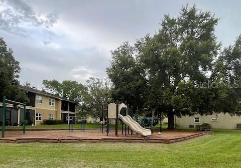 view of jungle gym with a lawn