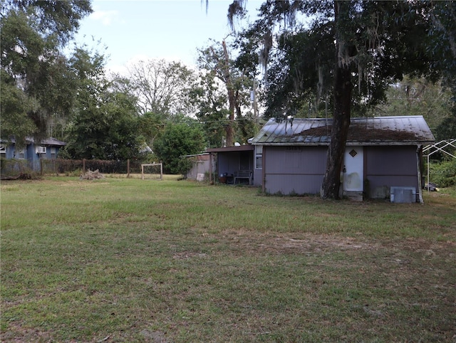 view of yard with central air condition unit