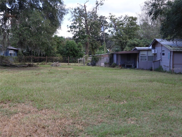 view of yard featuring a wall mounted AC