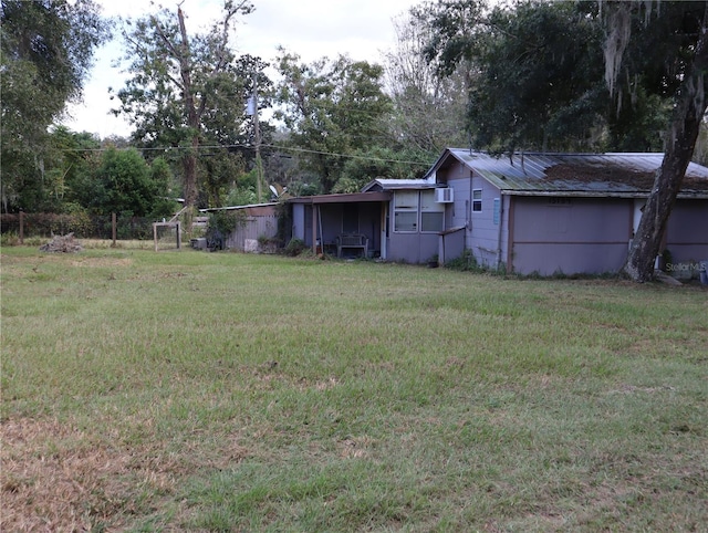 view of yard with a wall mounted AC