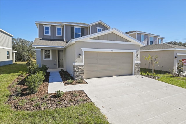 craftsman house with a garage and a front yard