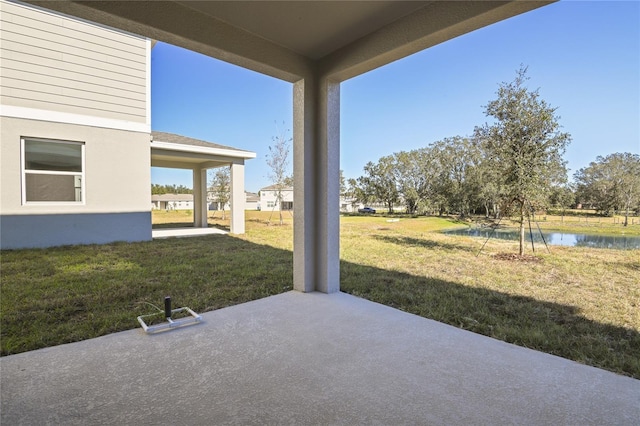 view of patio featuring a water view