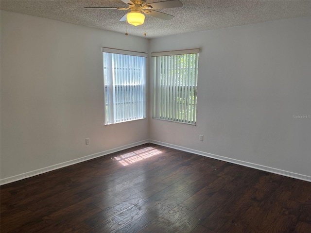 empty room with a textured ceiling, hardwood / wood-style flooring, and ceiling fan