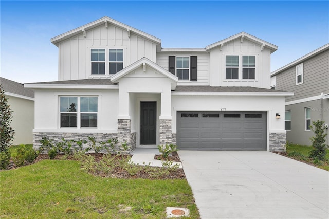 craftsman-style home featuring a garage and a front lawn