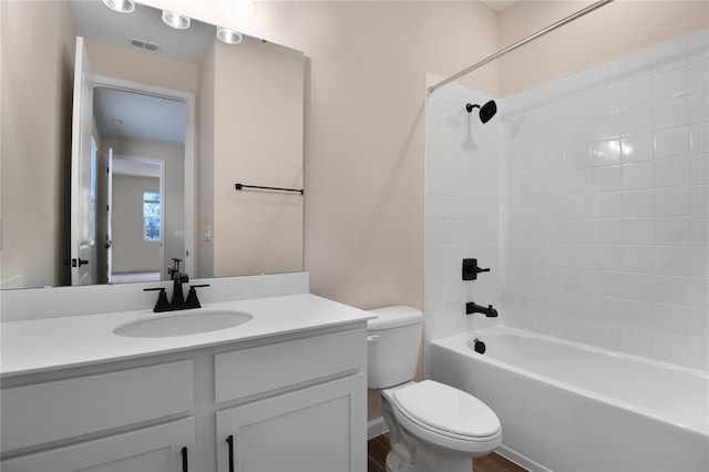 full bathroom with shower / bathtub combination, vanity, toilet, and wood-type flooring