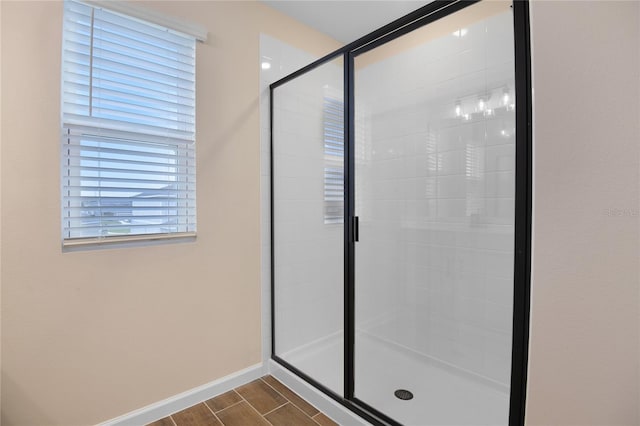 bathroom with a shower with shower door