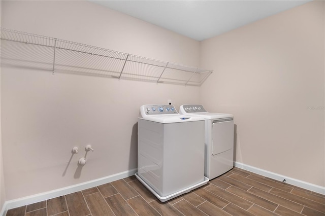 laundry room with washing machine and clothes dryer