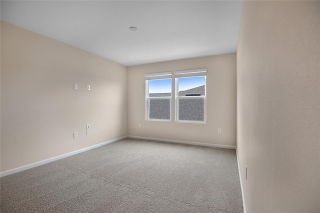 unfurnished room featuring carpet